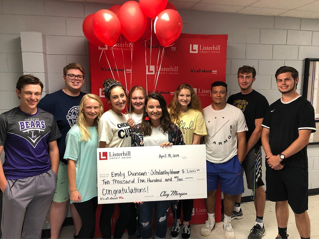 Emily Duncan Holding Check Group Photo
